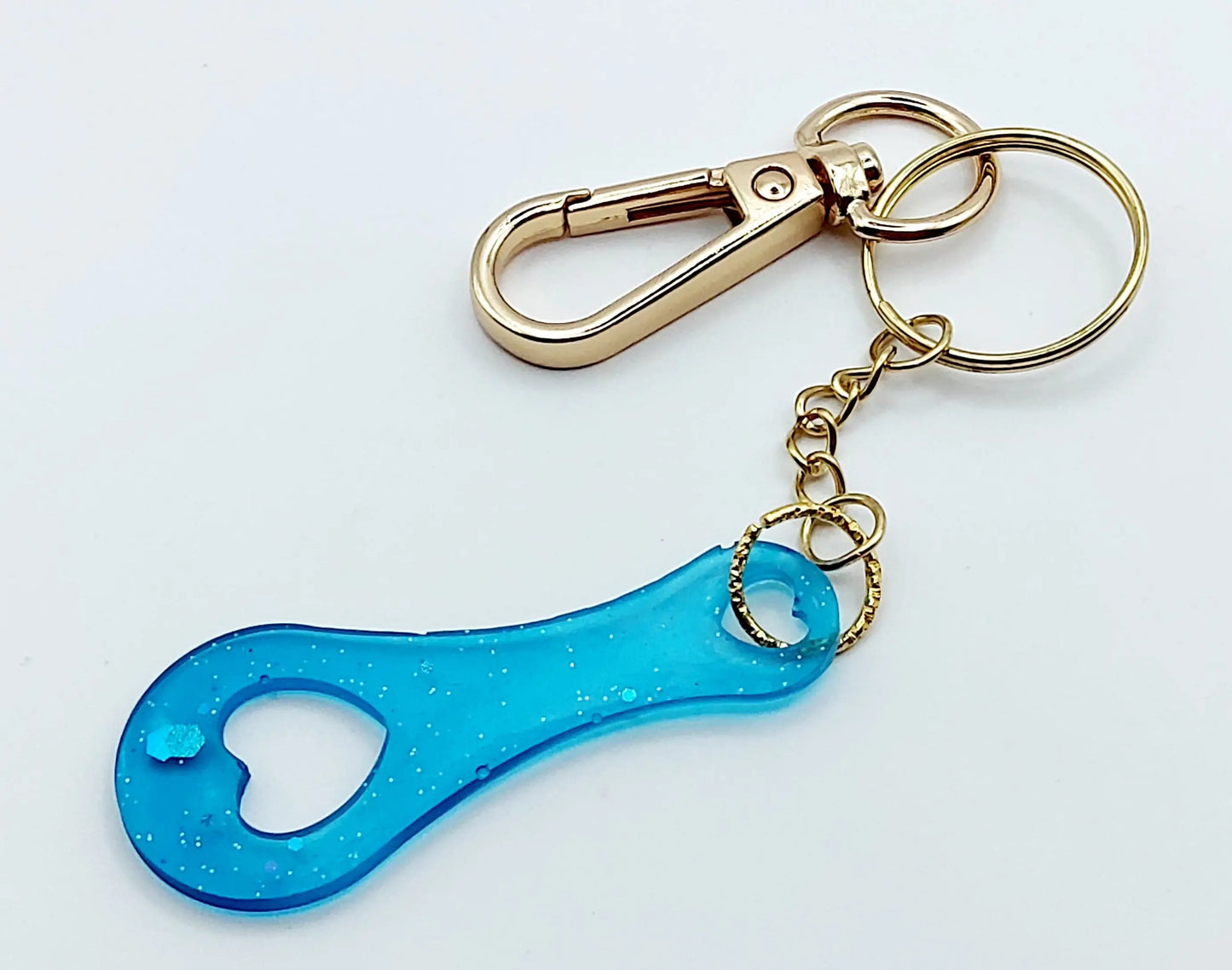 Porte-clés Jeton de caddie en résine époxy, turquoise translucide. Anneau et mousquetons dorés.