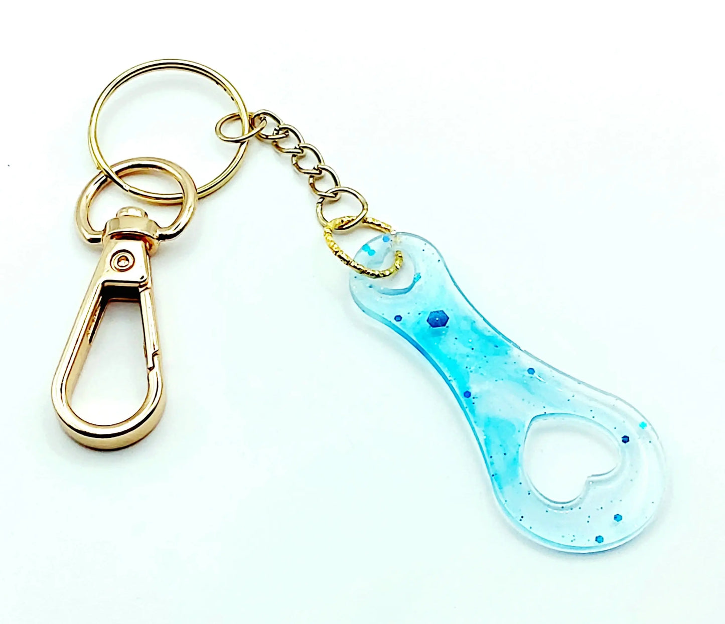 Porte-clés Jeton de caddie en résine époxy, transparent et turquoise. Anneau et mousqueton dorés.