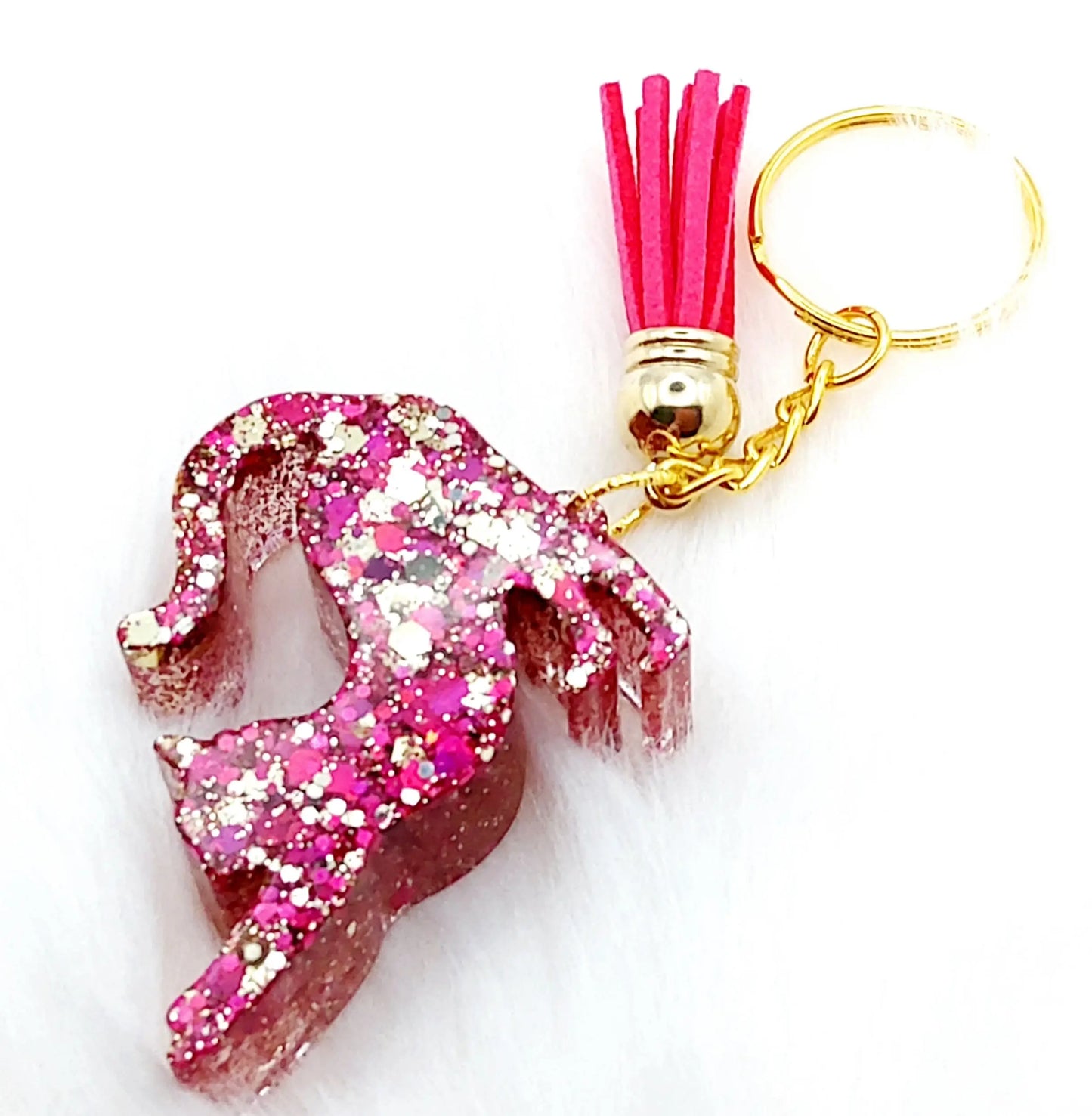 Porte-clés CHAT QUI S'ETIRE en résine. Paillettes roses et or
