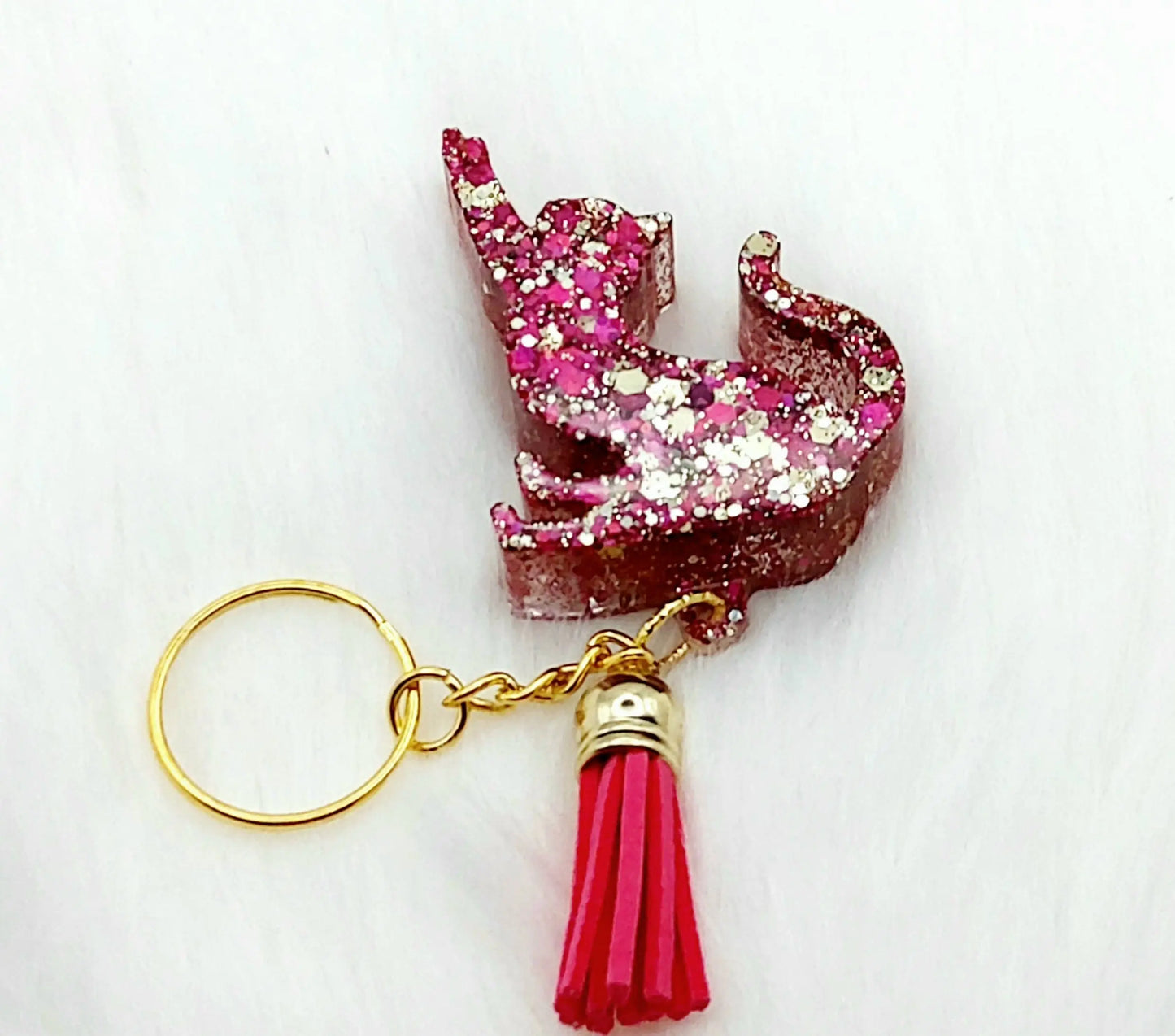 Porte-clés CHAT QUI S'ETIRE en résine. Paillettes roses et dorées