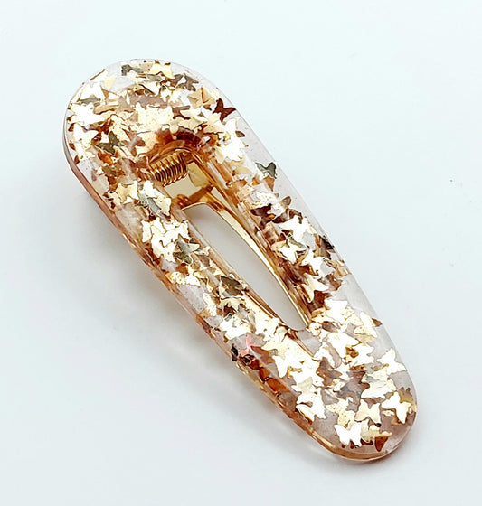 Barrette "Arrondie" en résine époxy, paillettes papillons dorées.