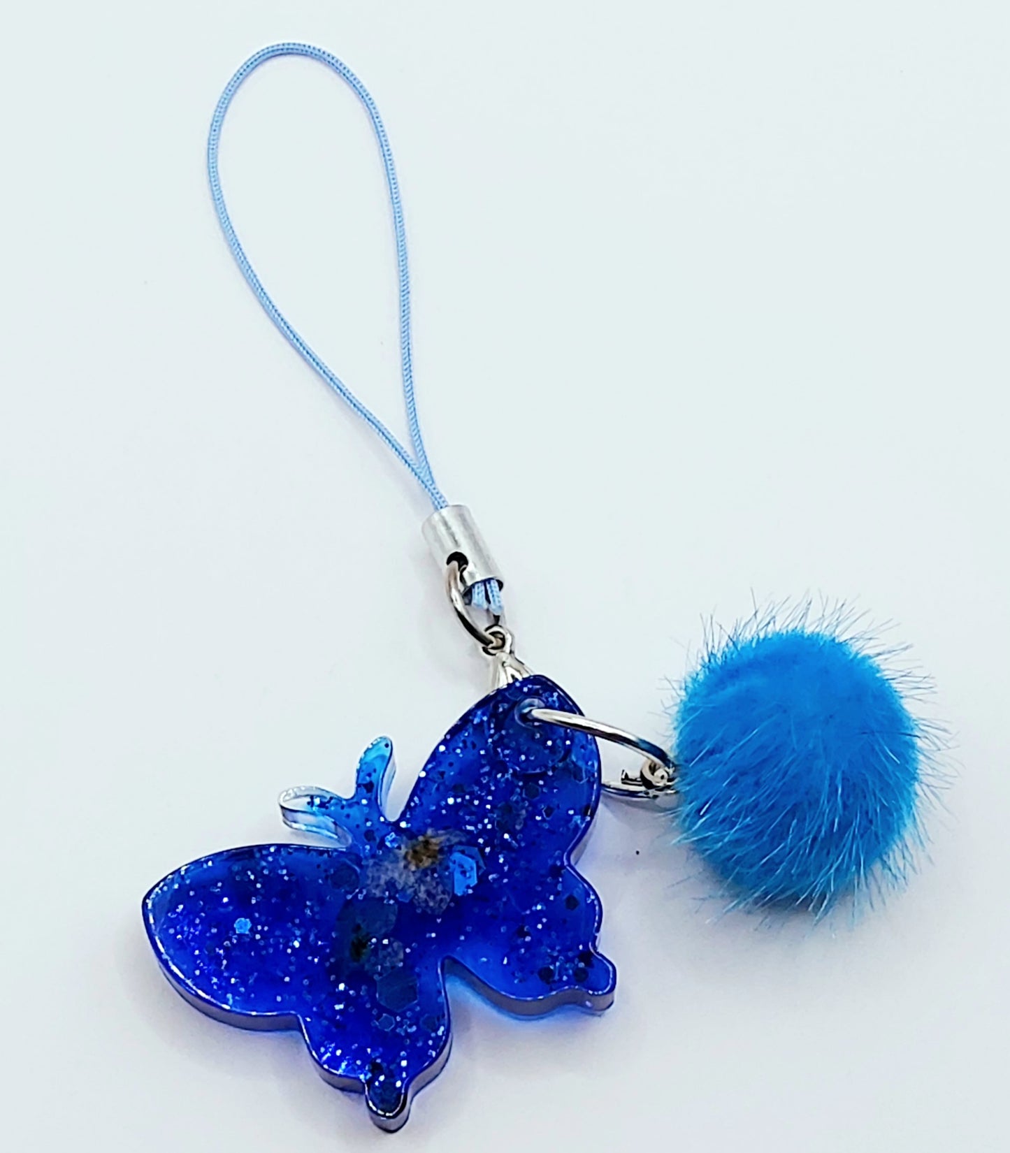 Bijou de téléphone Papillon en résine époxy - Bleu avec paillettes - Pompon et dragonne bleue 