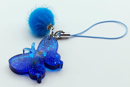 Bijou de téléphone Papillon en résine époxy - Bleu et paillettes