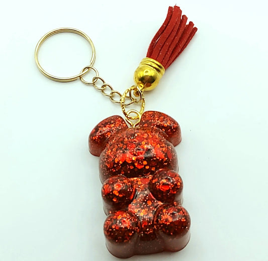 Porte-clés "Ourson debout" en résine époxy, paillettes rouges, pompon gland rouge, anneau doré.