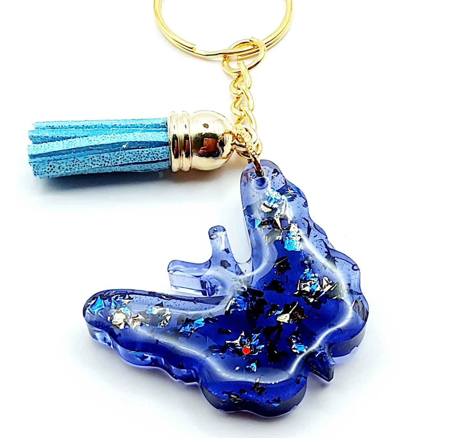 Porte-clés "Papillon" en résine époxy. Bleu et feuille d'or. Anneau doré. Pompon gland bleu ciel.